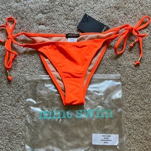 Orange bikini bottom. Size small. Ties on waist. never worn. Mint Swim.